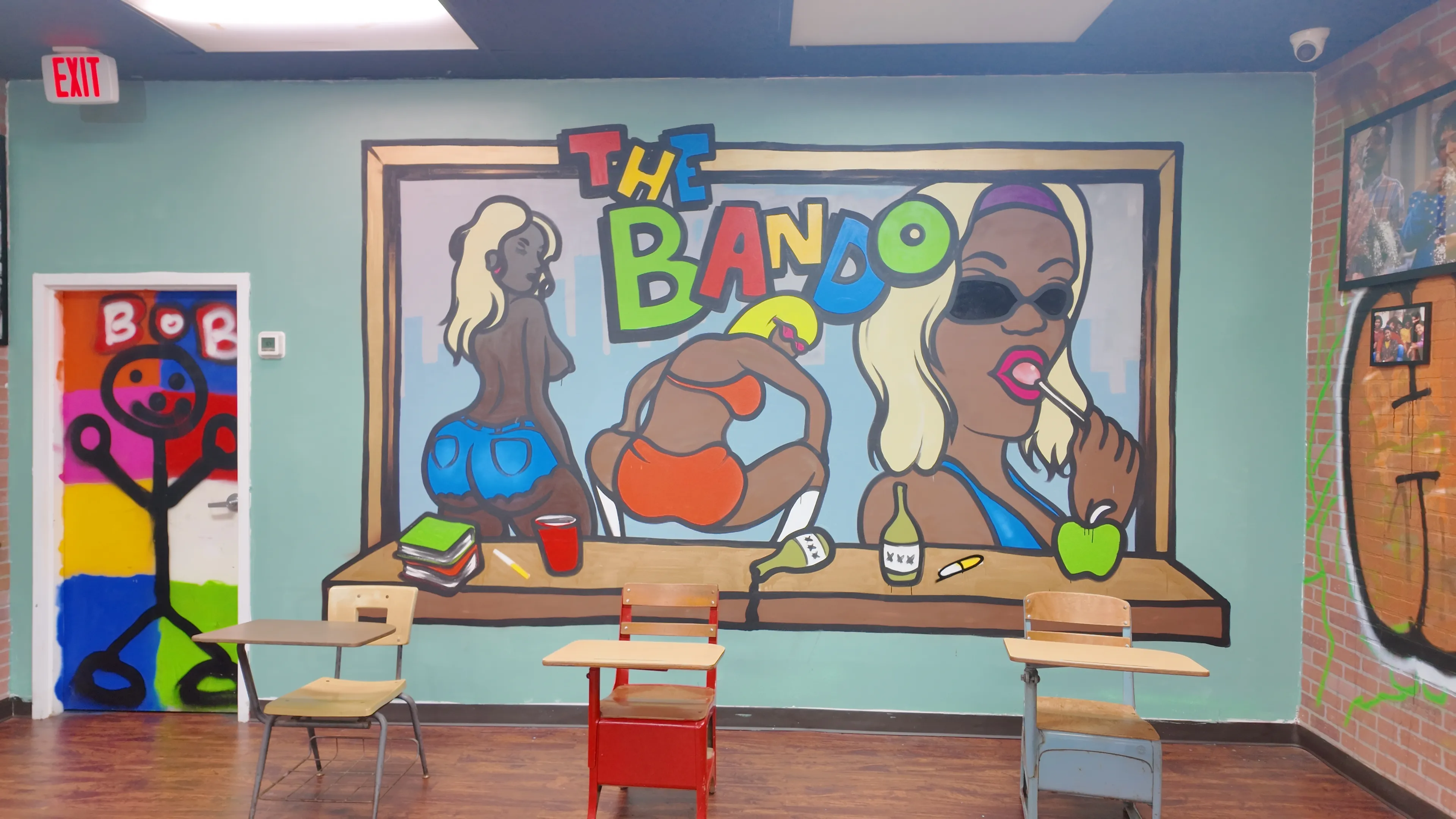 The Bando colorful mural featuring bold artwork and seating area