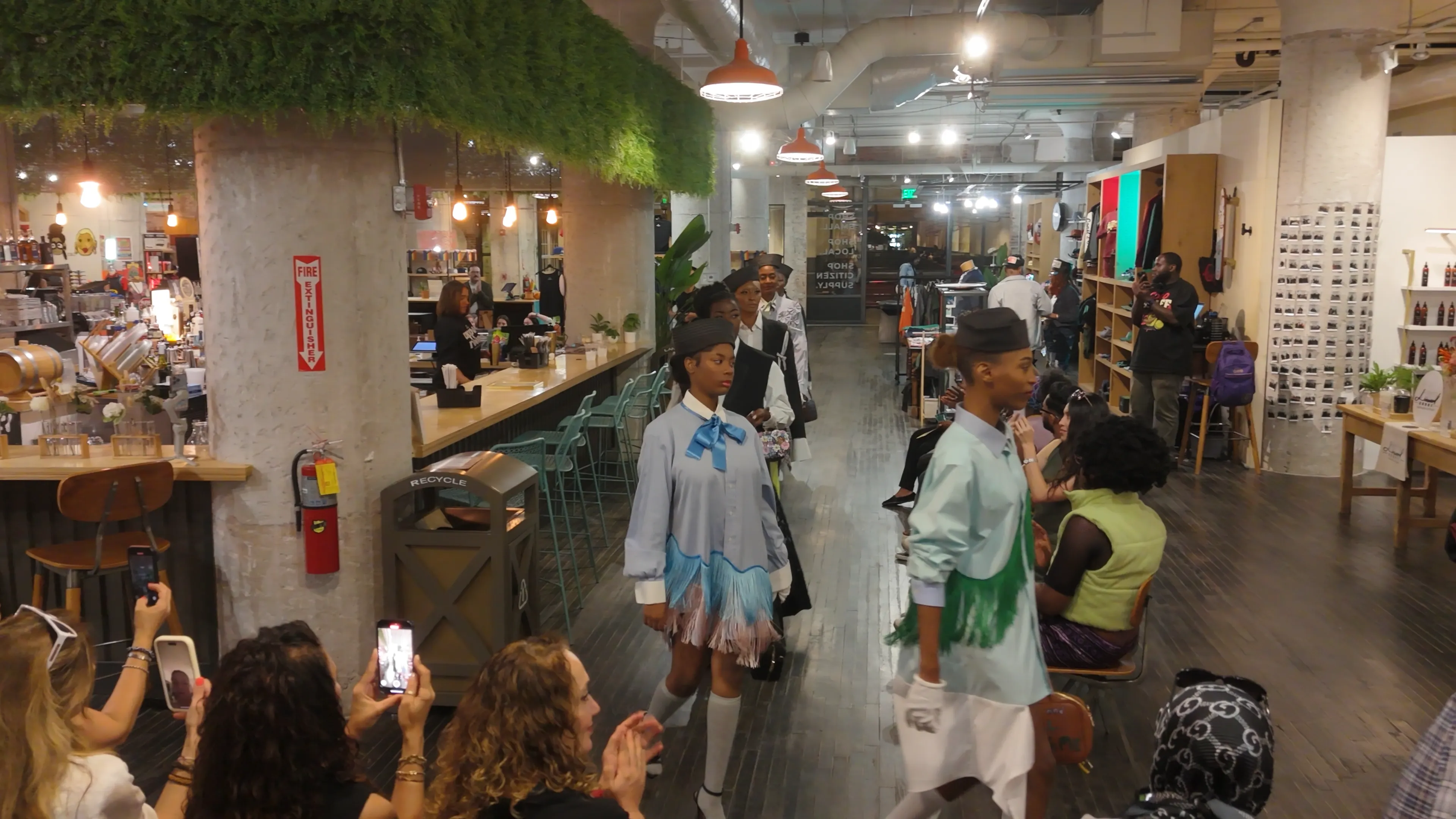Models showcasing sustainable fashion designs at Aysegul Ikna's Ponce City Market runway event